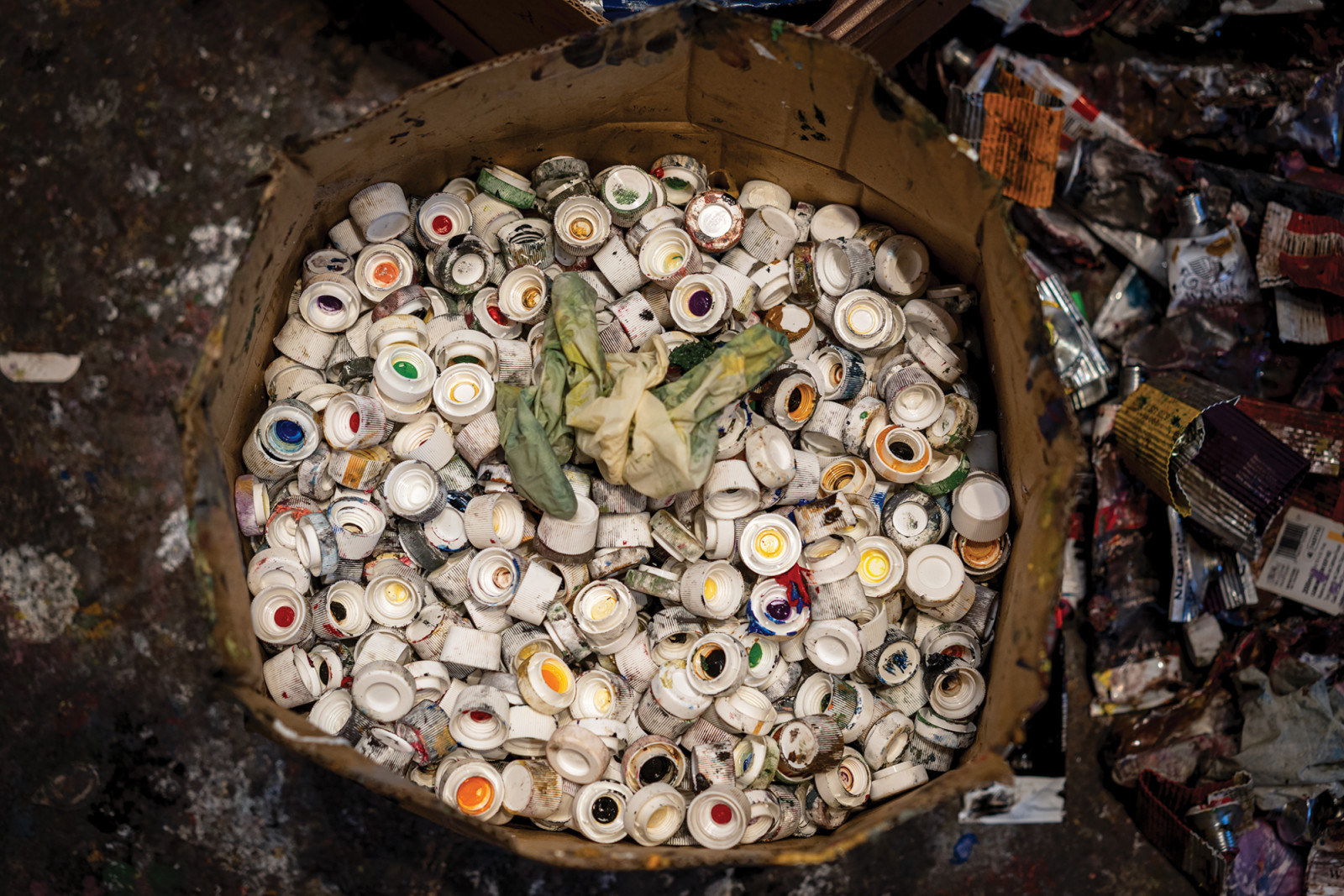 Discarded caps from the tubes of oil paint