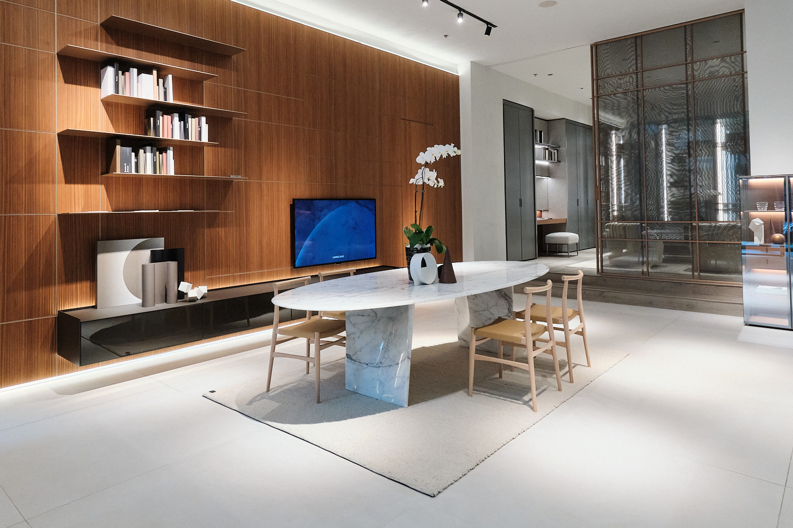 A dining room and living room vignette on display at Bespoke Doors & Furniture's 10th anniversary celebration