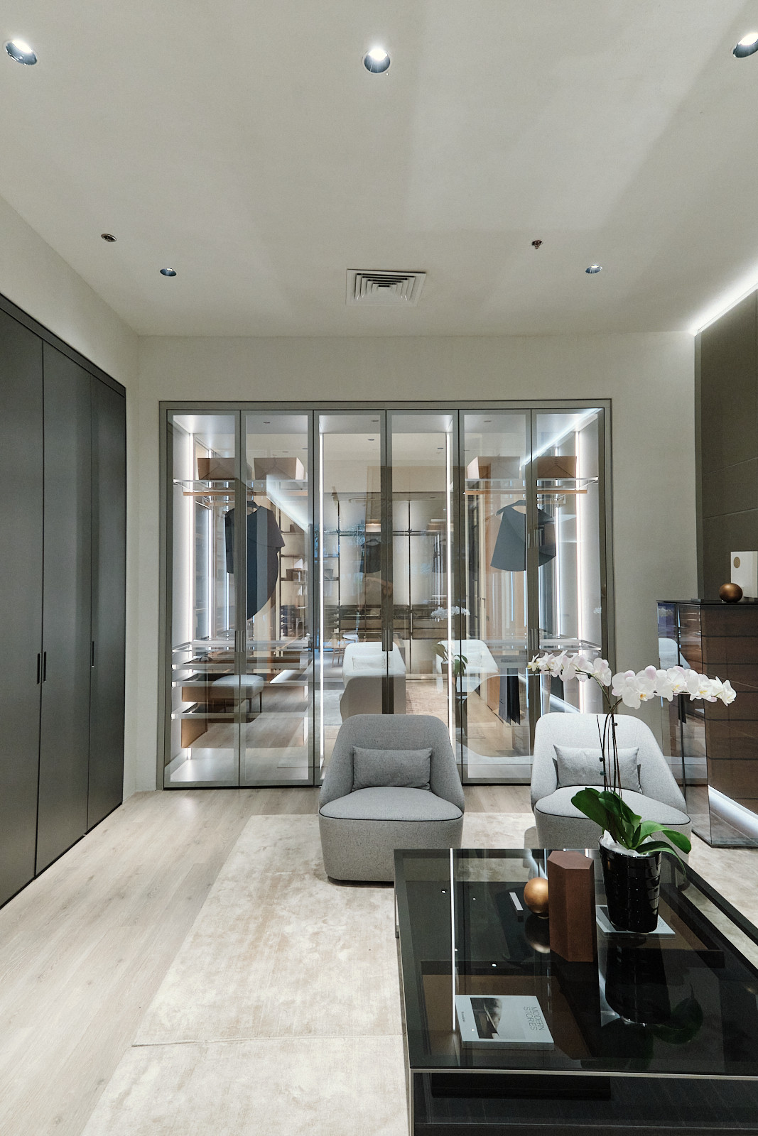 A walk-in closet and bedroom on display at Bespoke Doors & Furniture's 10th anniversary celebration
