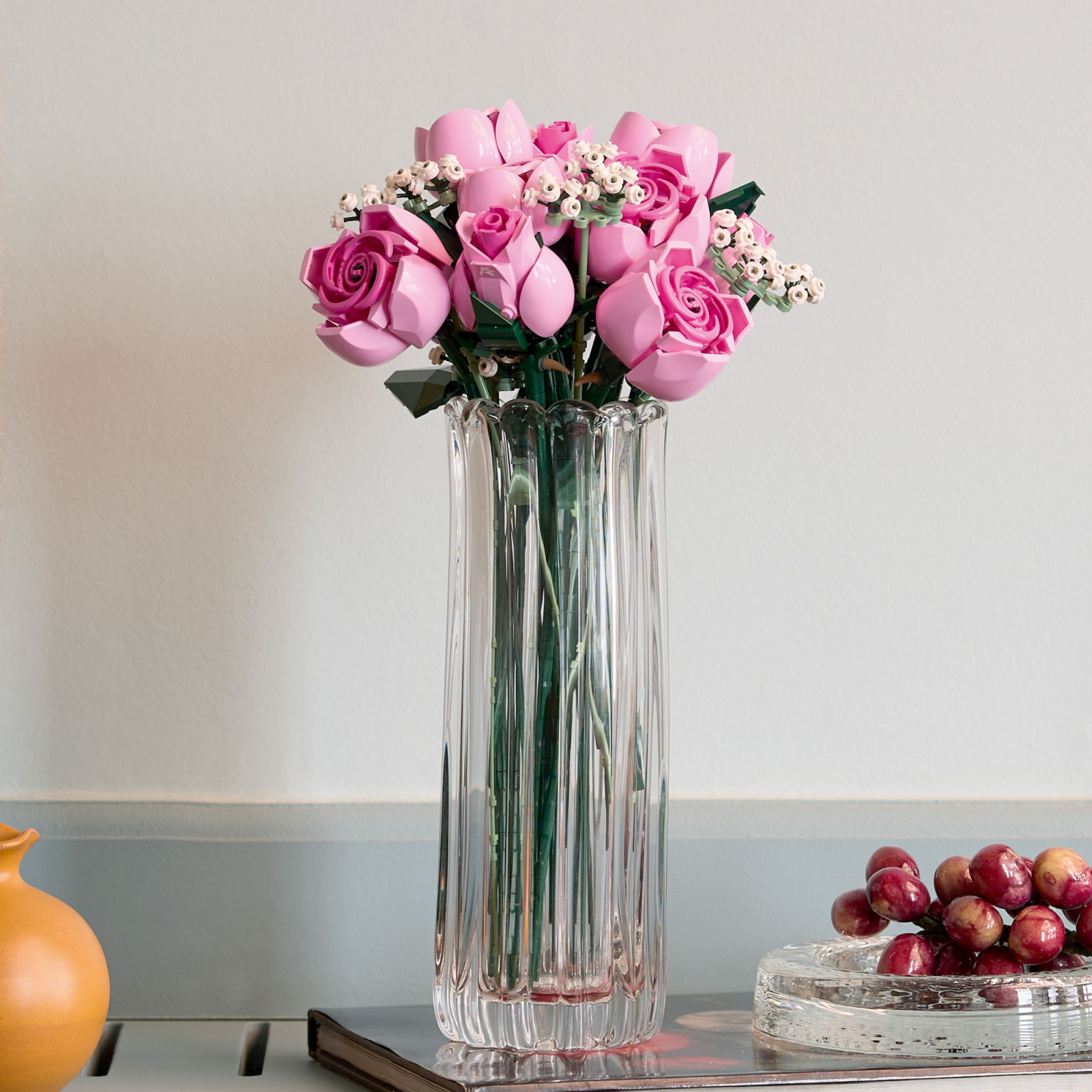 The Bouquet of Pink Roses comprises individual rose stems built from layered circular elements that form graduated petals