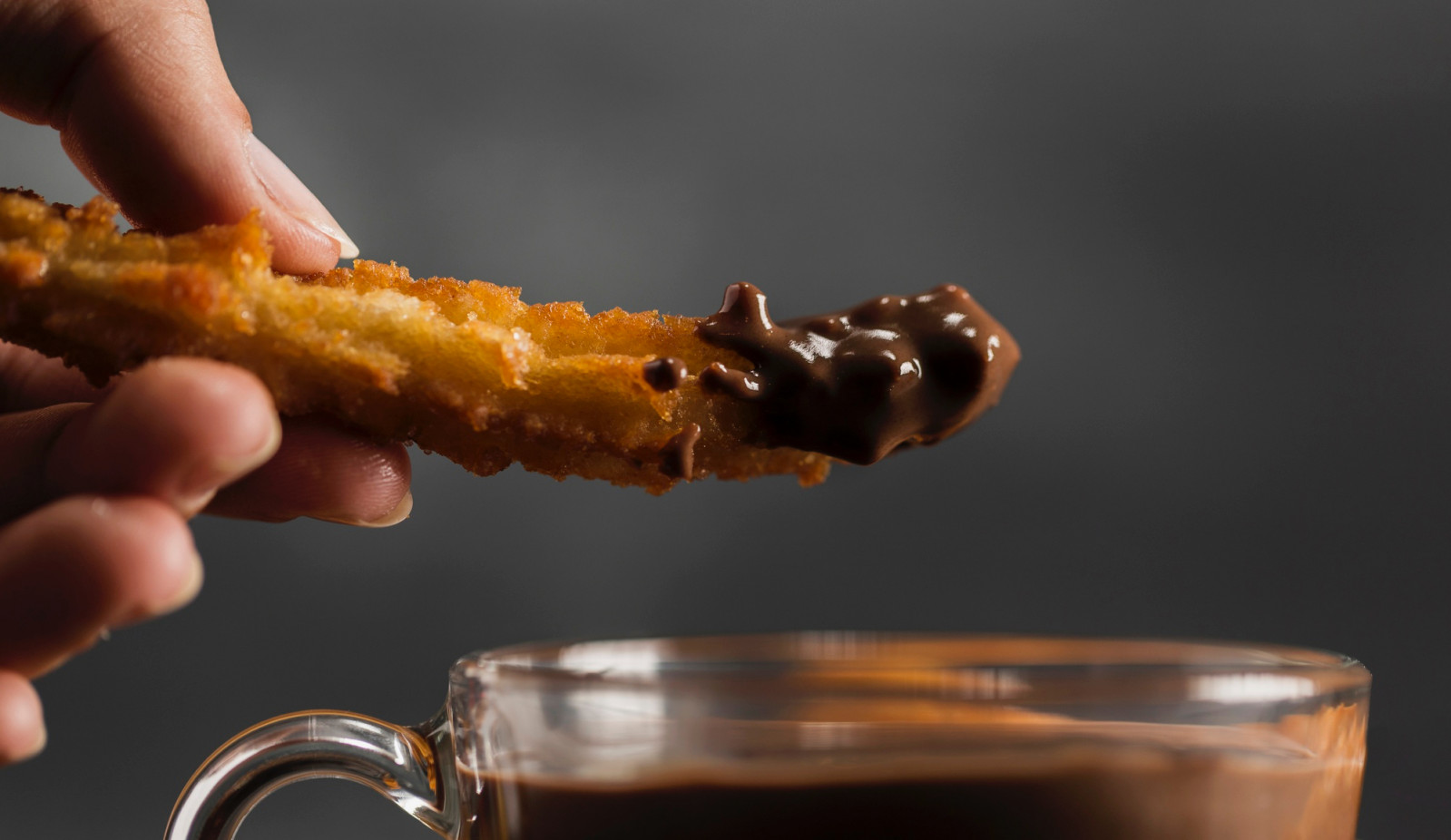 As Europe's original gateway to cacao, the nation maintains a fierce cultural loyalty to the thick, spiced hot chocolate traditionally served with churros (Photo: Freepik)