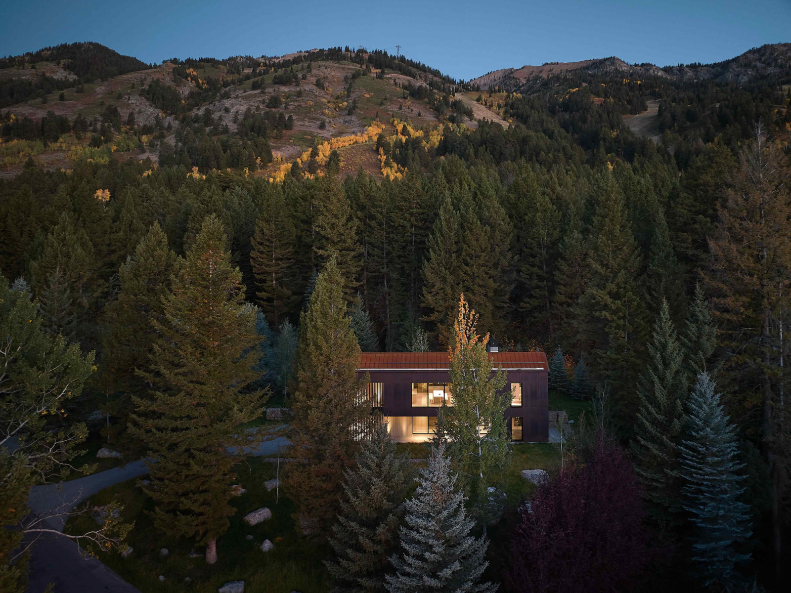 From its elevated position within dense timber, rugged topography, and scattered boulders