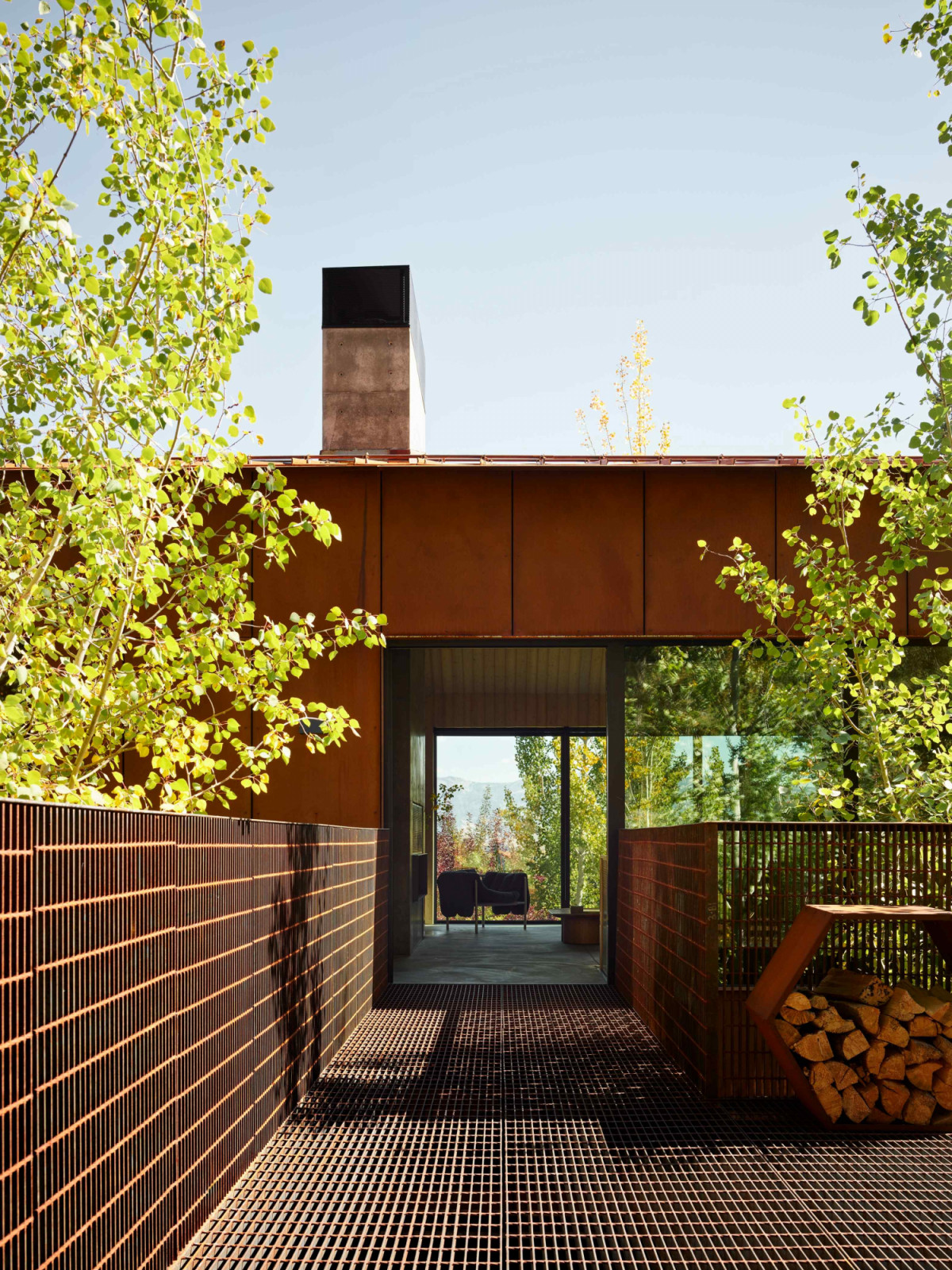 The rust-coloured façade will develop a living patina that blends into the surrounding environment