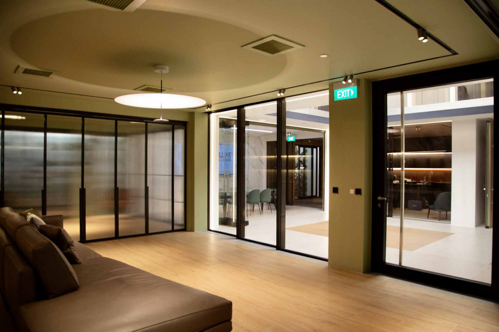 Glass doors lead to the double volume space of the showroom
