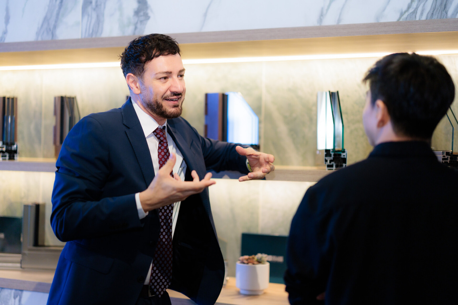 Fabio Lorenzini giving guests a tour of the showroom