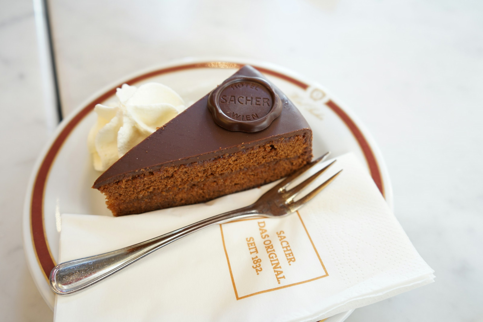 Historic cafés serve Sachertorte, strudels and tortes, making dessert a daily ritual as well as a taste of tradition (Photo: Luke Wang/Unsplash)