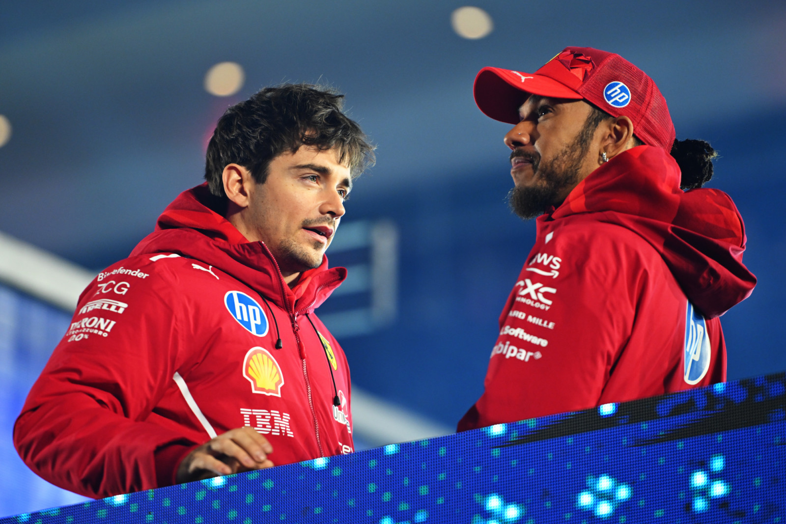 LAS VEGAS, NEVADA - NOVEMBER 22: Charles Leclerc of Monaco and Scuderia Ferrari and Lewis Hamilton of Great Britain and Scuderia Ferrari talk on the drivers parade prior to the F1 Grand Prix of Las Vegas at Las Vegas Strip Circuit on November 22, 2025 in Las Vegas, Nevada. (Photo by Rudy Carezzevoli/Getty Images)