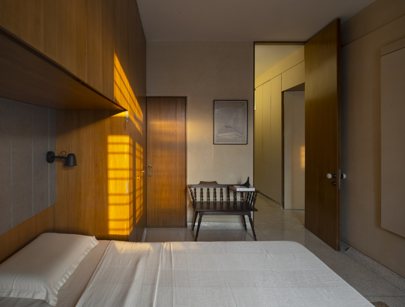 The guest bedroom of a renovated Art Deco home by Studio UF+O in Mumbai, India