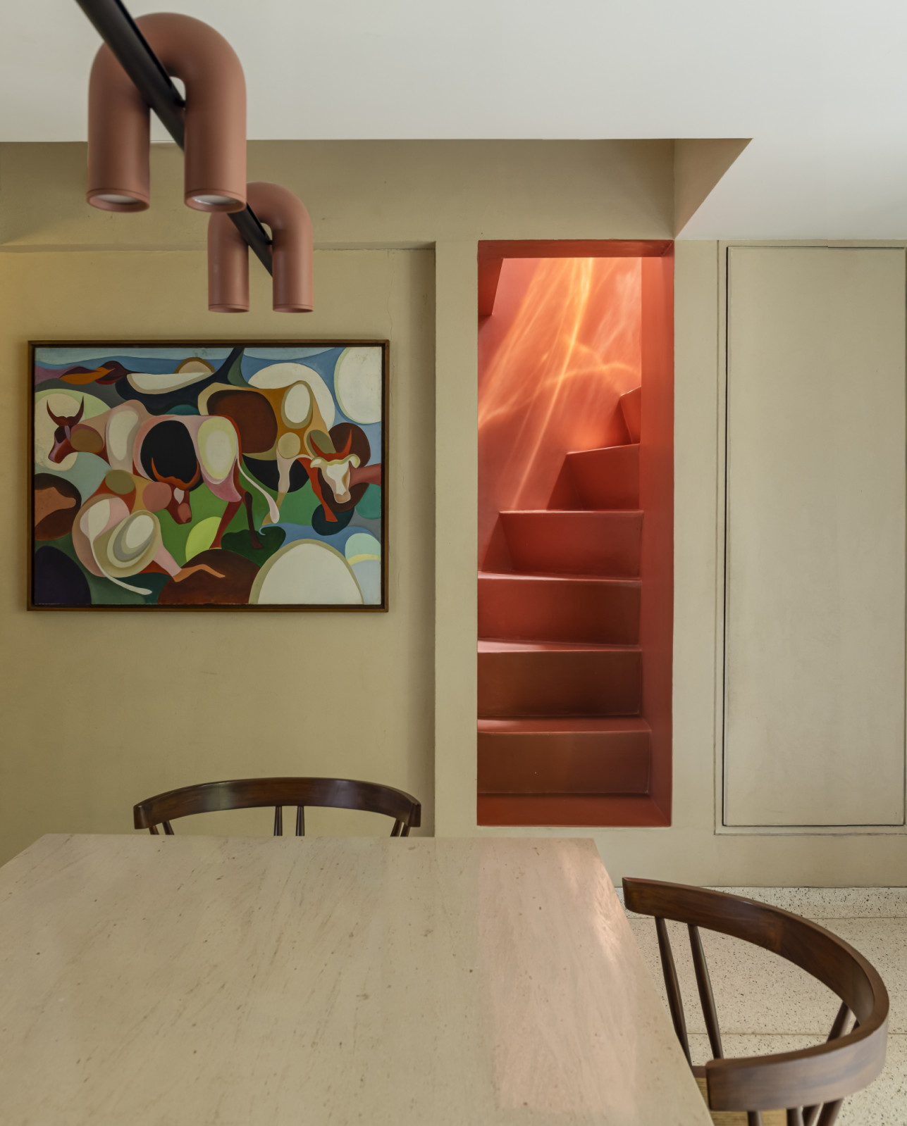 The dining room room of a renovated Art Deco home by Studio UF+O in Mumbai, India