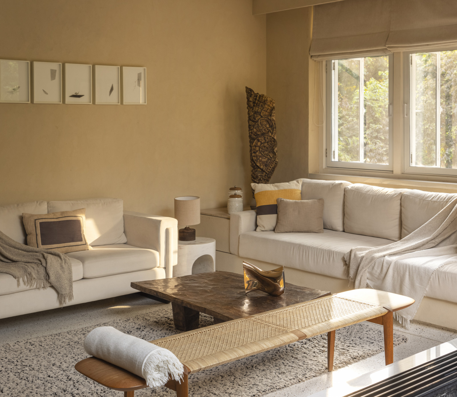 The living room of a renovated Art Deco home by Studio UF+O in Mumbai, India