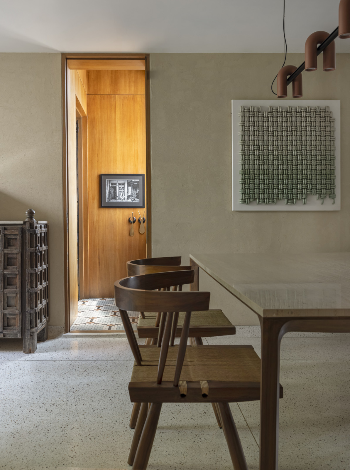 The dining room of a renovated Art Deco home by Studio UF+O in Mumbai, India
