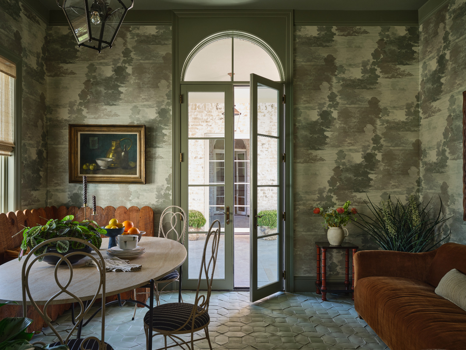 A more informal dining area that leads to the outdoors in a home designed by Shane & Pierce in Dallas, Texas