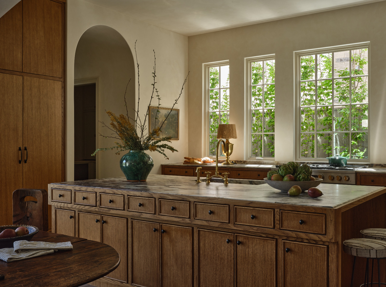 The inviting kitchen that celebrates craftsmanship and natural lighting in a home designed by Shane & Pierce in Dallas, Texas