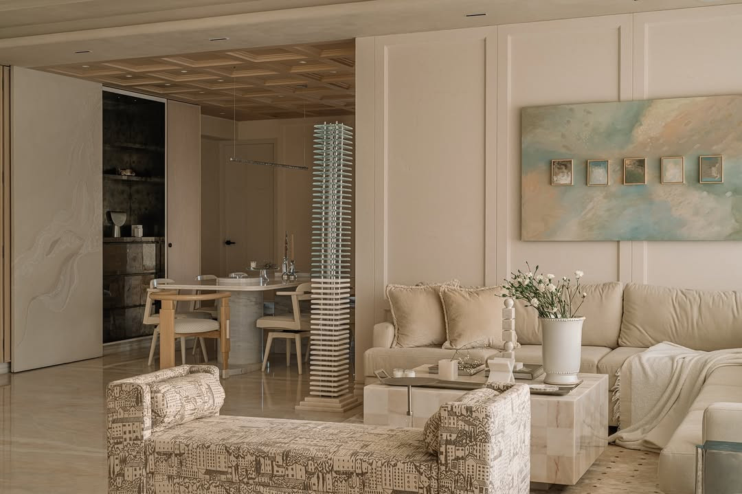 The muted palette shifts to soft whites in the living room