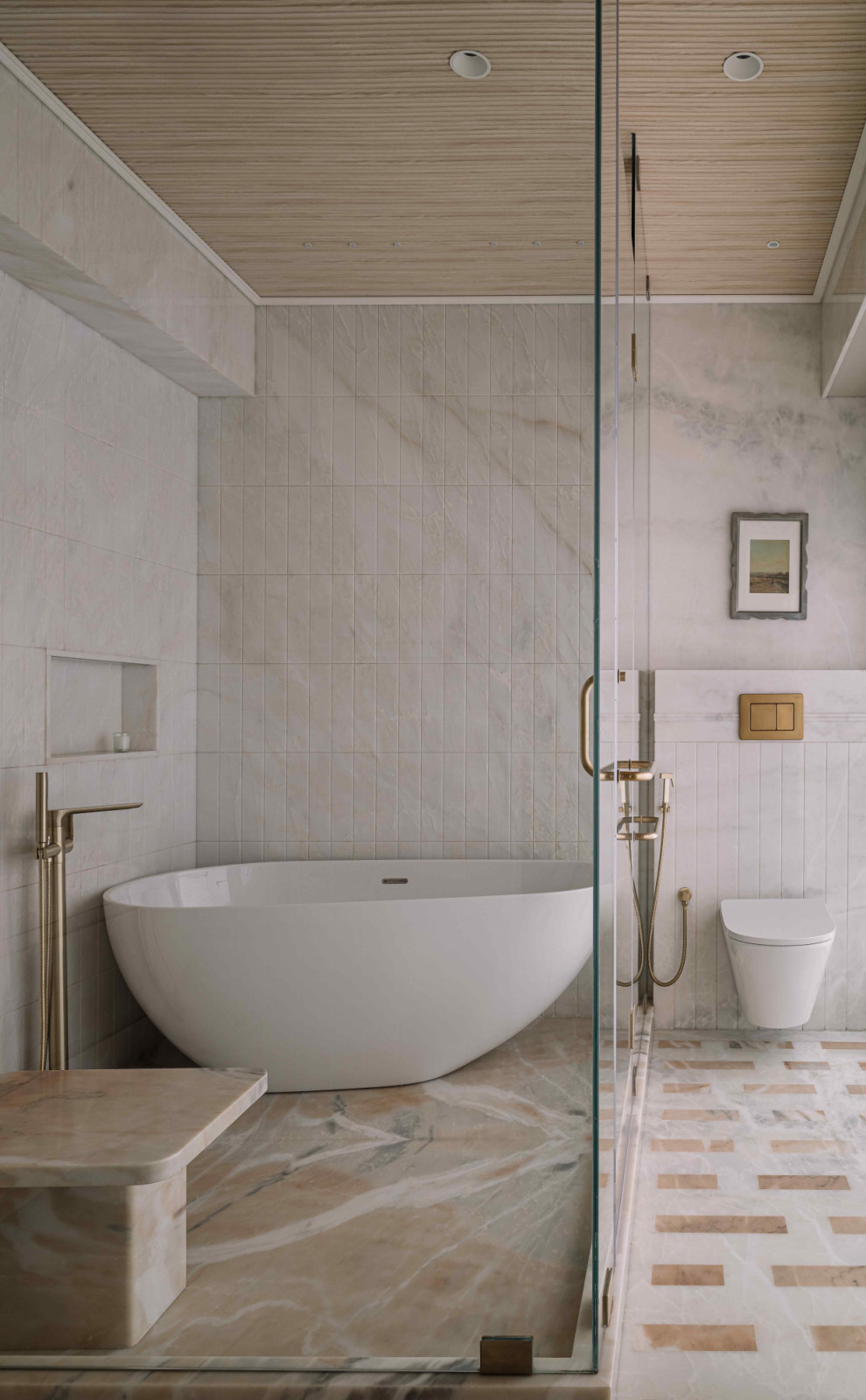 Brass fixtures warm the palette with a gentle, luxurious radiance