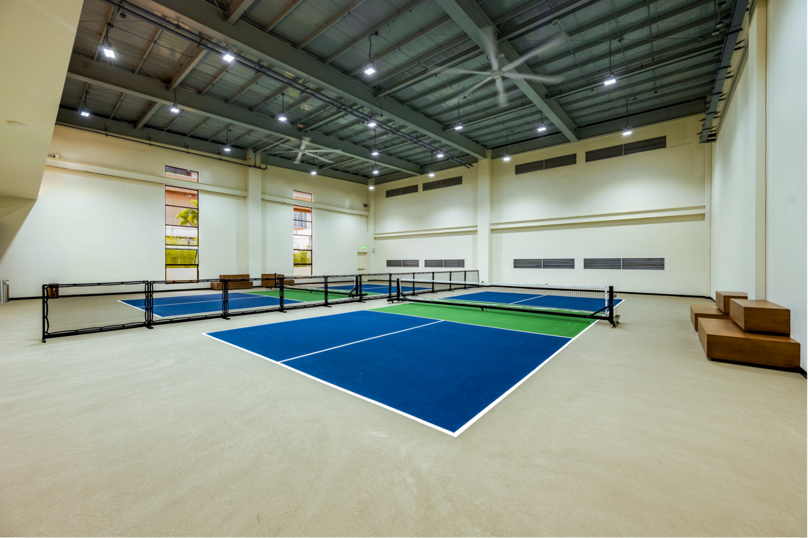 A quick game of padel or pickleball at the Solaire Sports Club