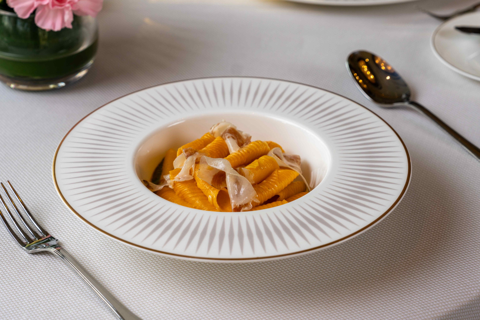 Egg yolk garganelli with a generous sprinkle of guanciale