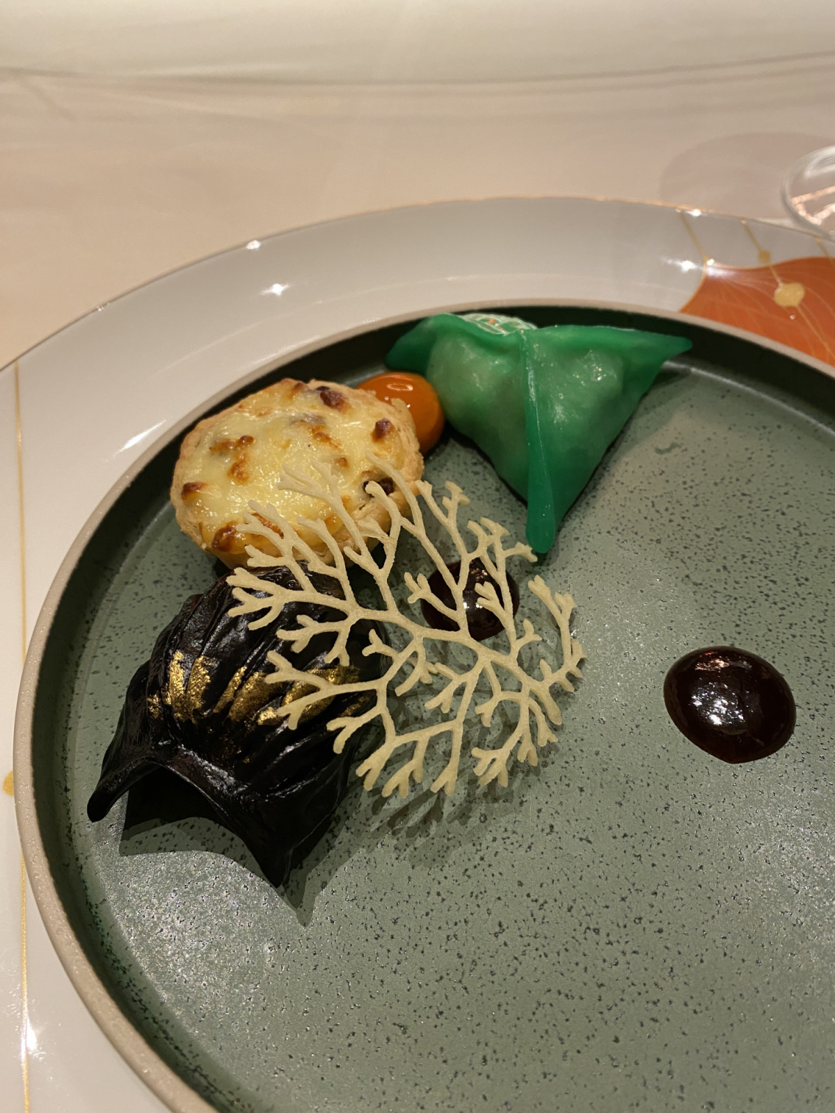 Red Lantern: shrimp dumpling, wagyu beef with egg yolk tart, steamed scallop with black truffle, and bok choy dumpling (Photo: Celeste Goh)