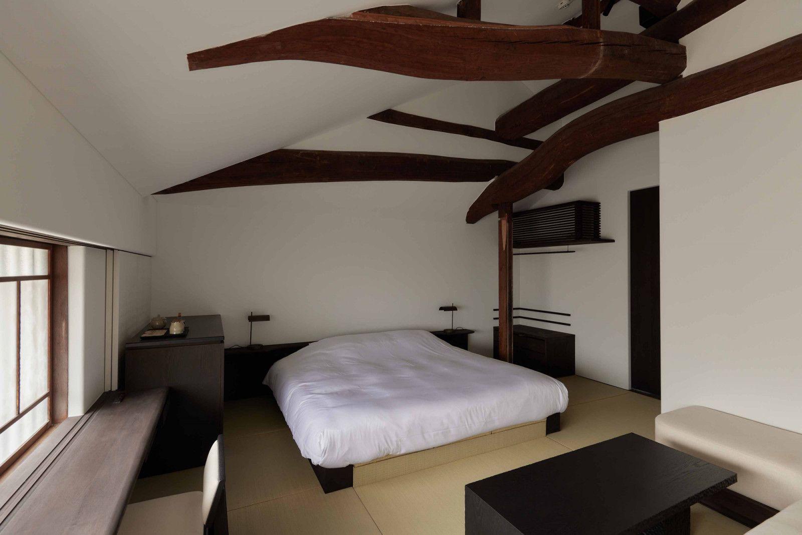 The bed area of Yoruya’s standard room