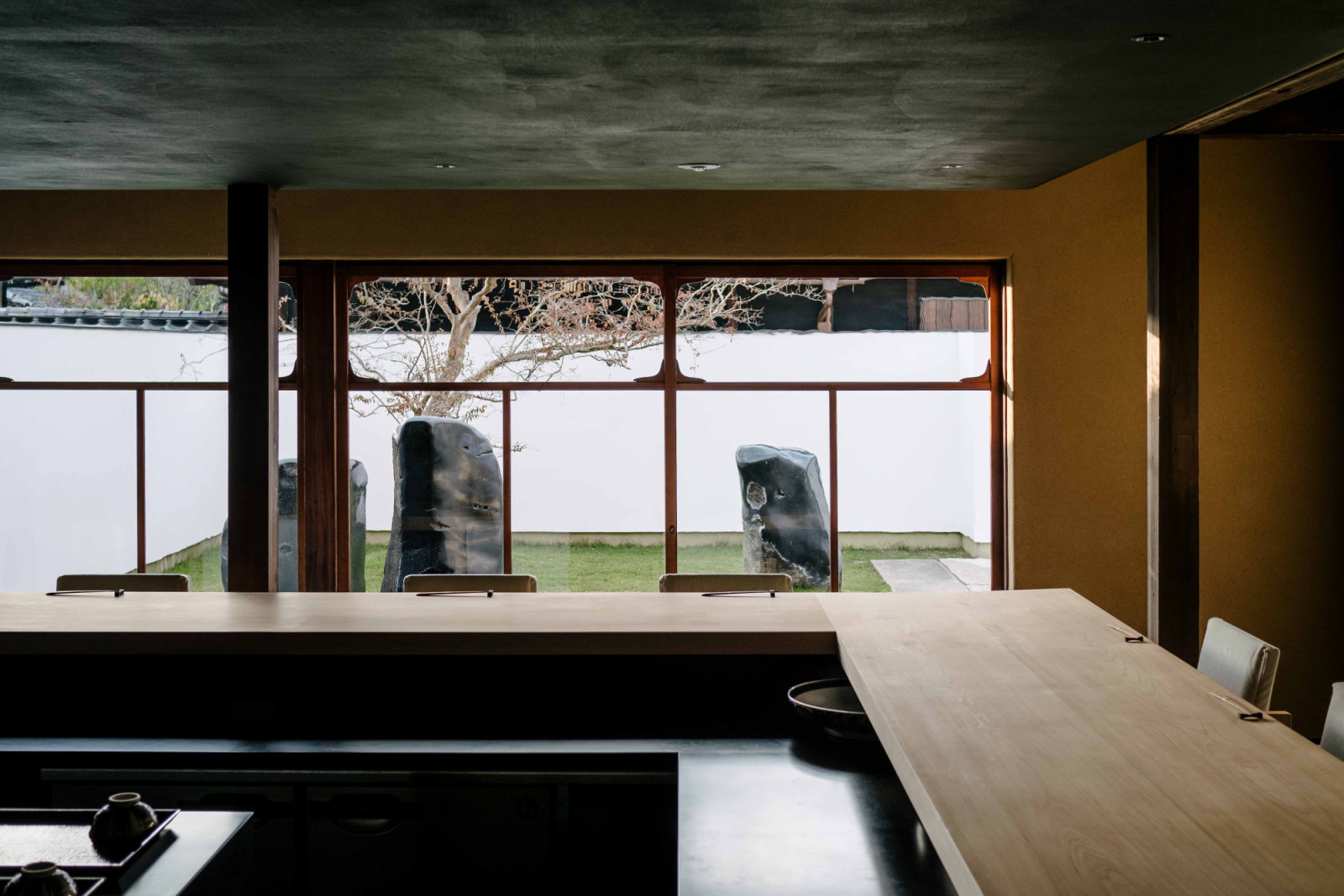 The dining area overlooks a sculptural garden