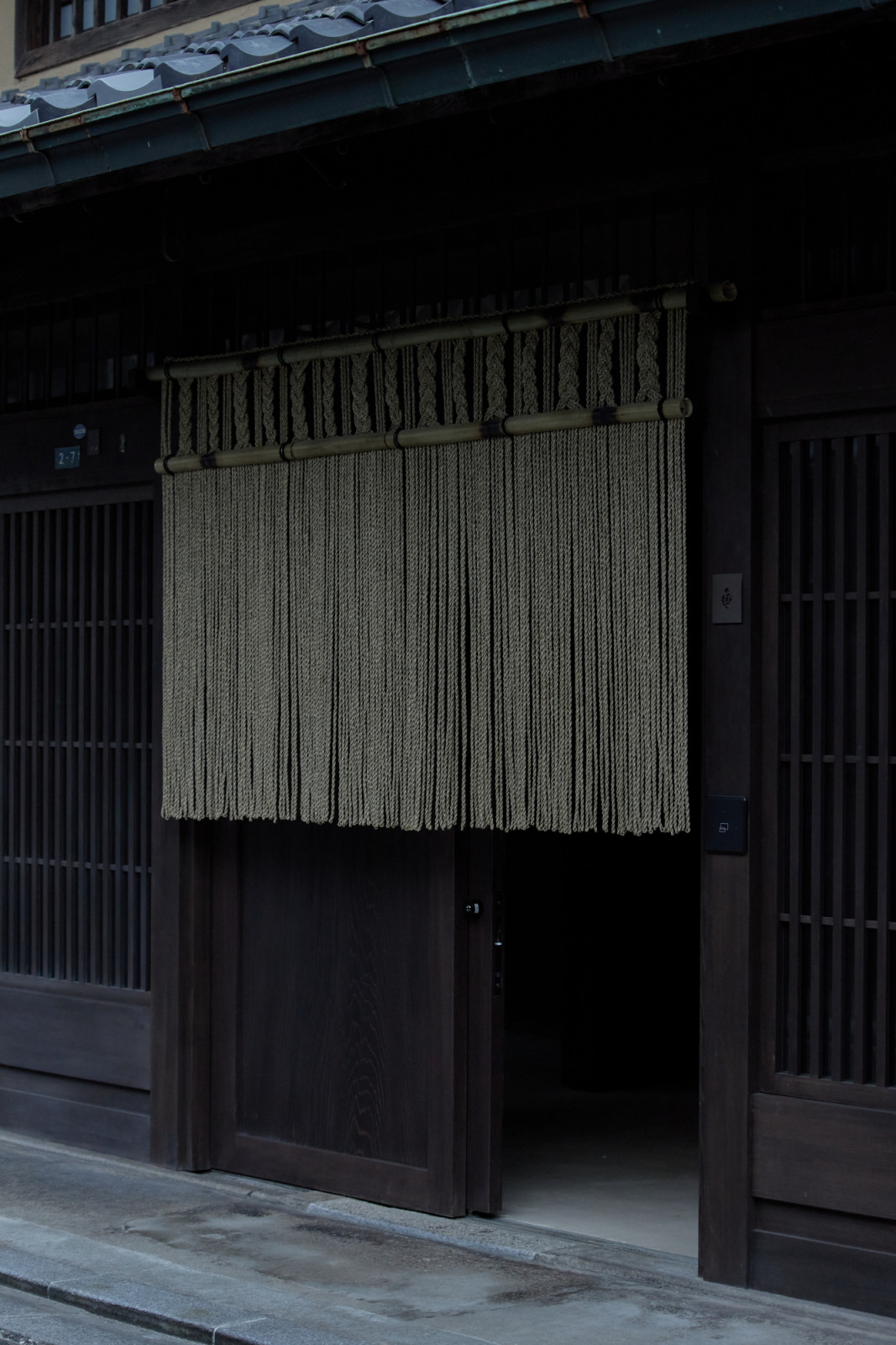 Entrance to Yoruya’s restaurant and bar area is marked with noren