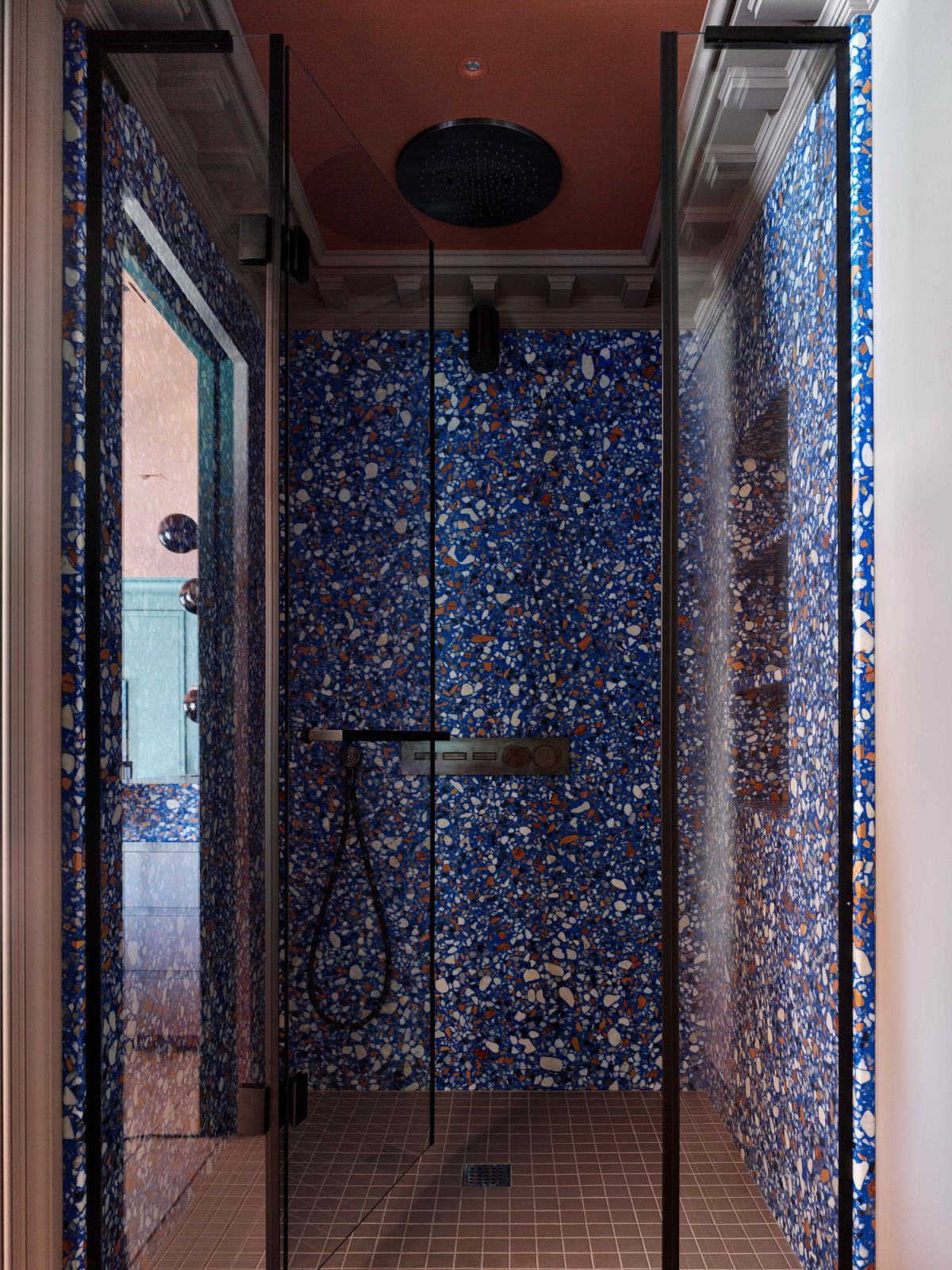 The main bathroom with custom blue terrazzo shower walls (Photo: Sergey Ananiev)