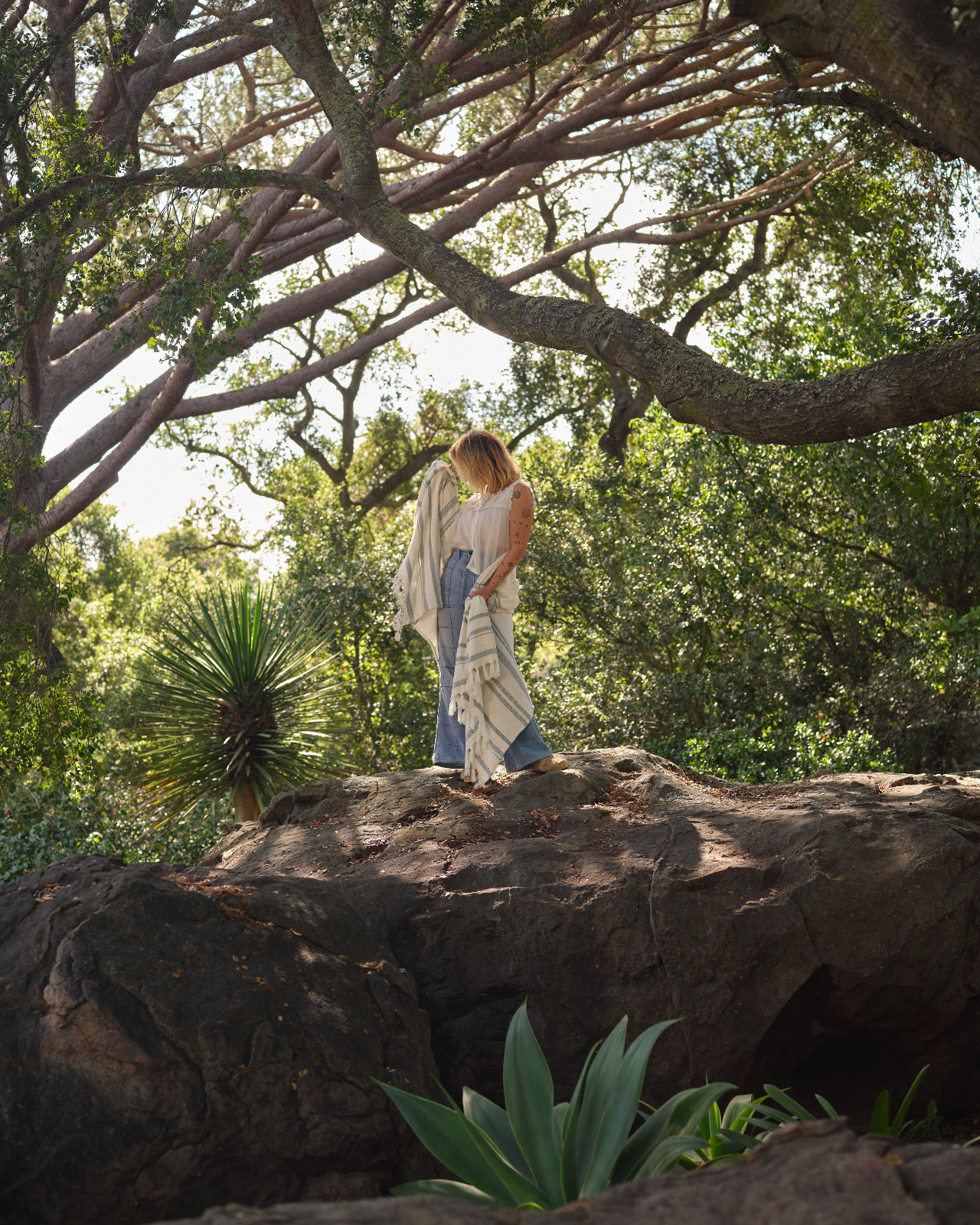 Tamara Honey exploring the landscape of a Montecito, California home designed with AB Design Studio