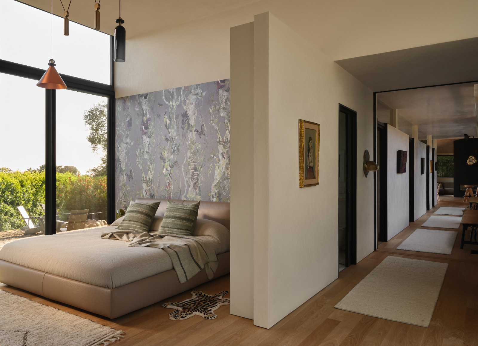 The primary bedroom and hallway of a Montecito, California home designed by Tamara Honey with AB Design Studio