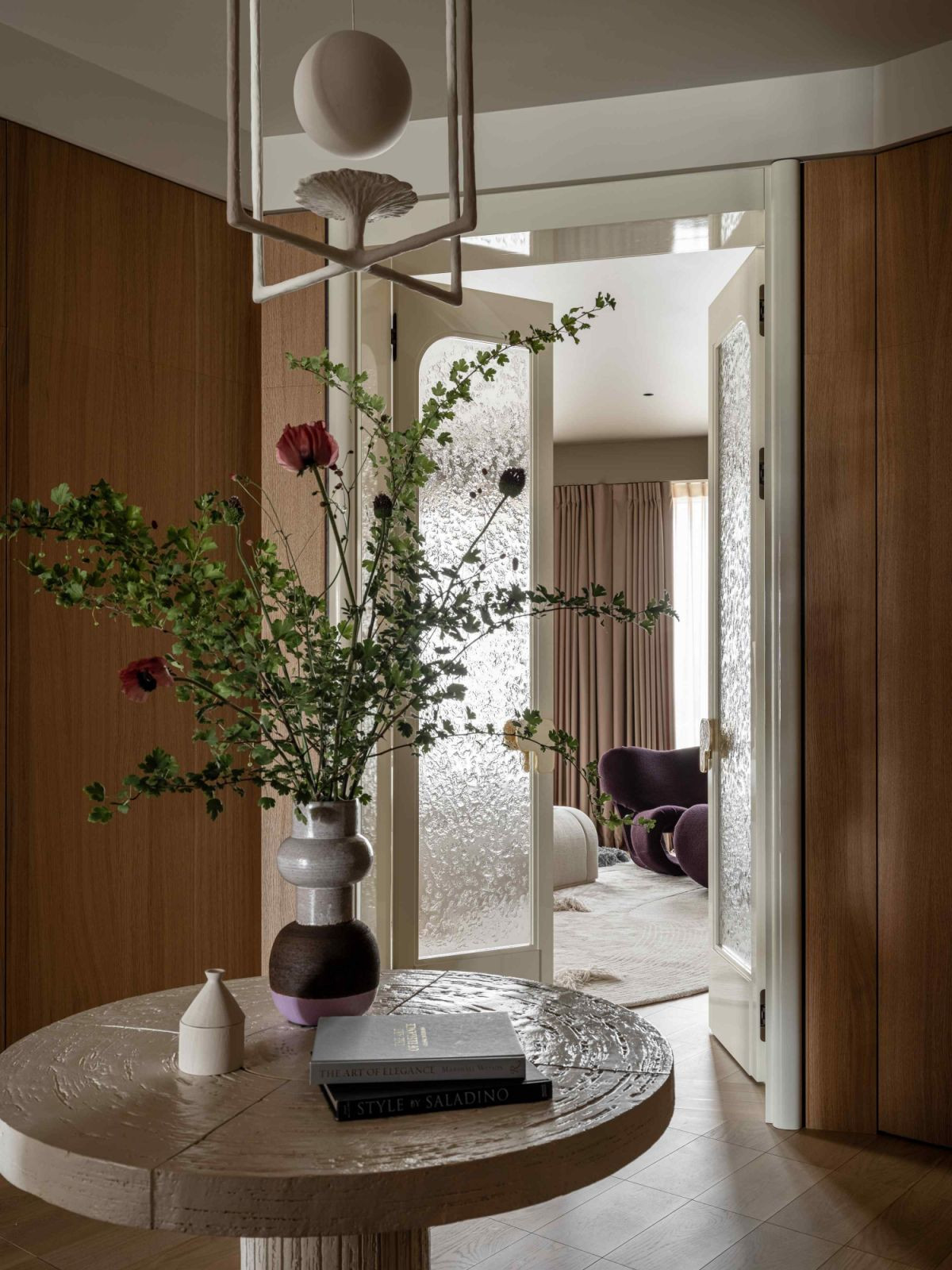 The master bedroom through frosted glass doors with bespoke brass and enamel door handles (Photo: Mikhail Loskutov)