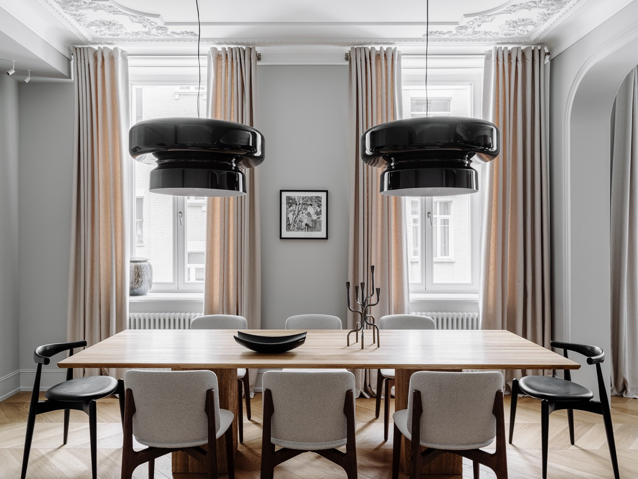 The light-filled dining area with a custom table, and a mix of Very Wood and Carl Hansen chairs (Photo: Mikhail Loskutov)