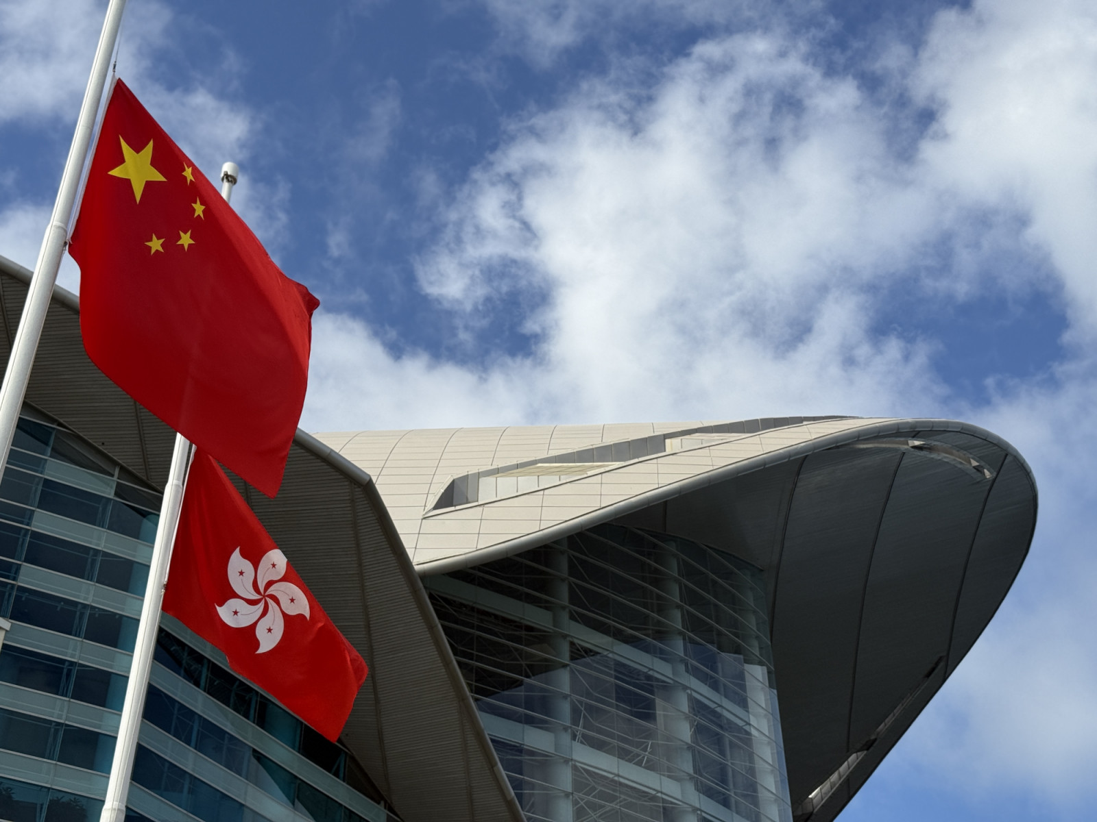 Flags flown at half-mast at Hong Kong's Golden Bauhinia Square on Nov 29, in honour of the lives lost at the Tai Po fires