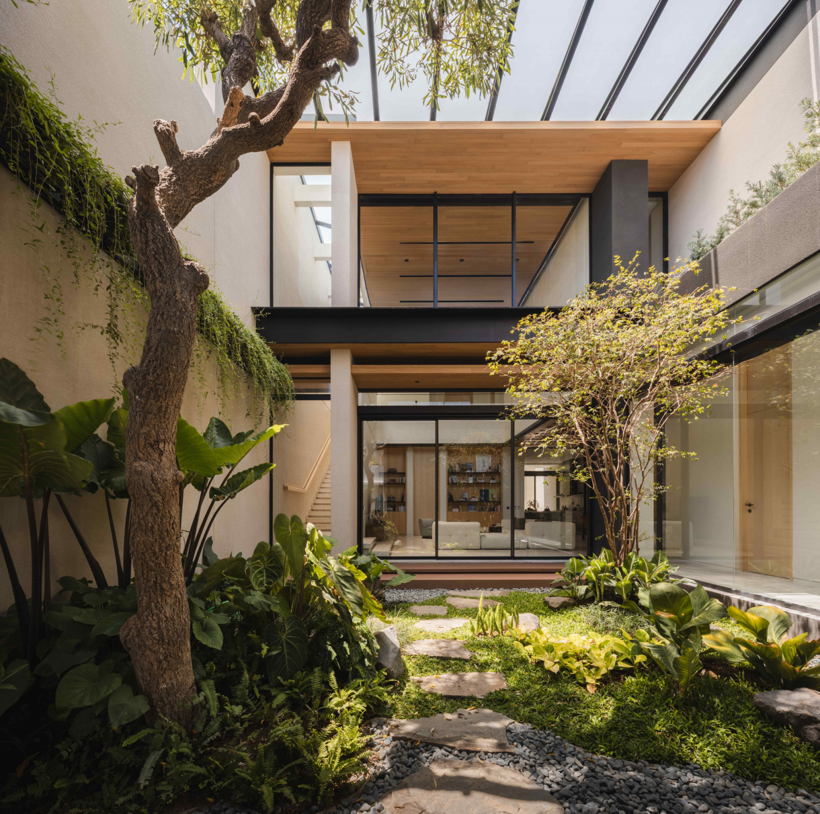 The courtyard is filled with vibrant Indonesian plantings