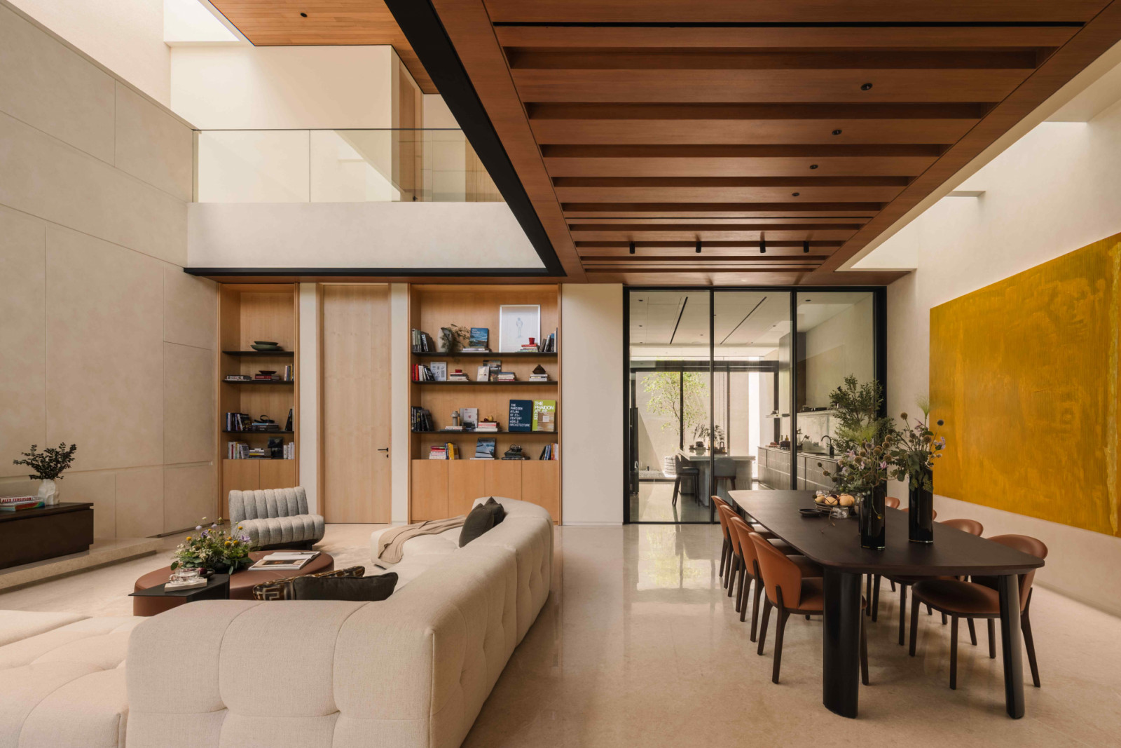 Dark oak ceiling beams and sycamore veneer ground the open-plan space