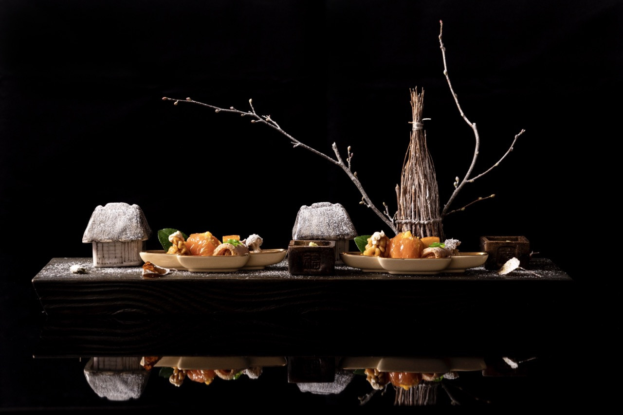At the main dining pavilion Kasuke, Japanese cuisine prepared as alpine kaiseki features river fish, game, and seasonal vegetables from the surrounding region