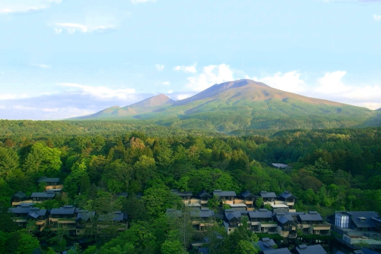 Hoshinoya Karuizawa sits in a valley carved by a river from Mount Asama, with architect Rie Azuma designing 22 different pavilion types oriented to specific site conditions