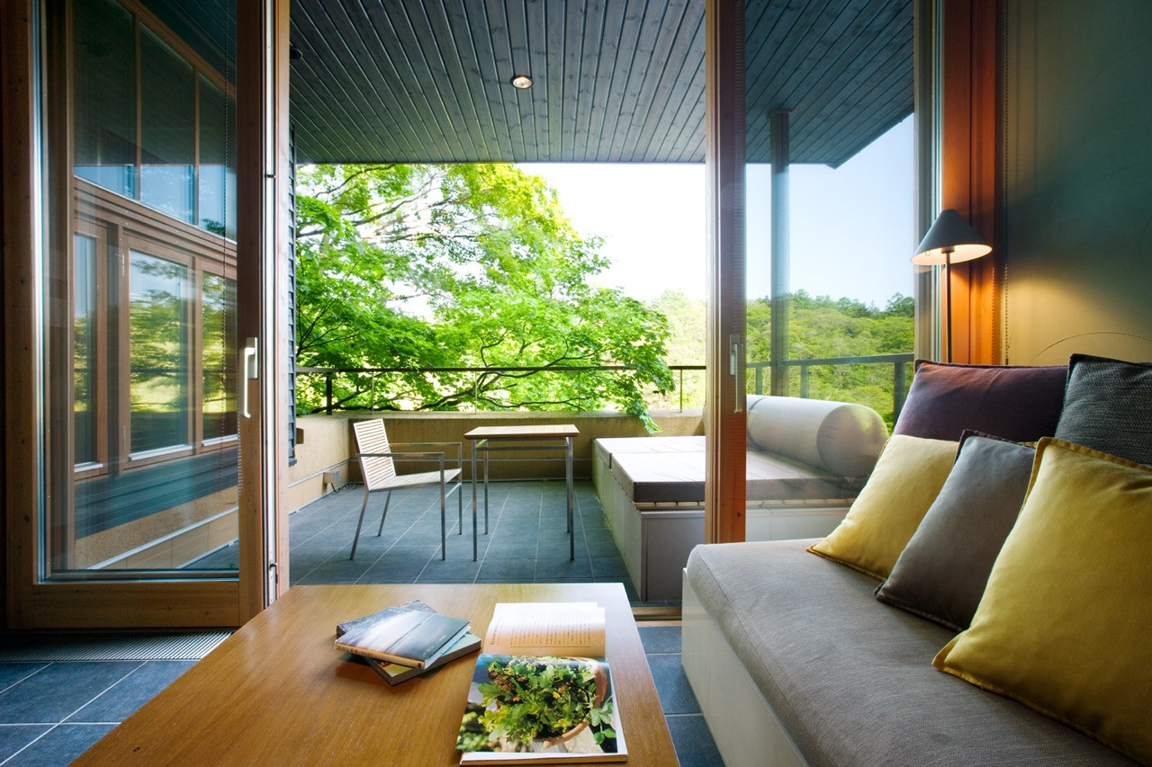 Azuma designed each room as a viewing platform that frames the valley beyond, with terraces serving as transitional spaces between inside and out