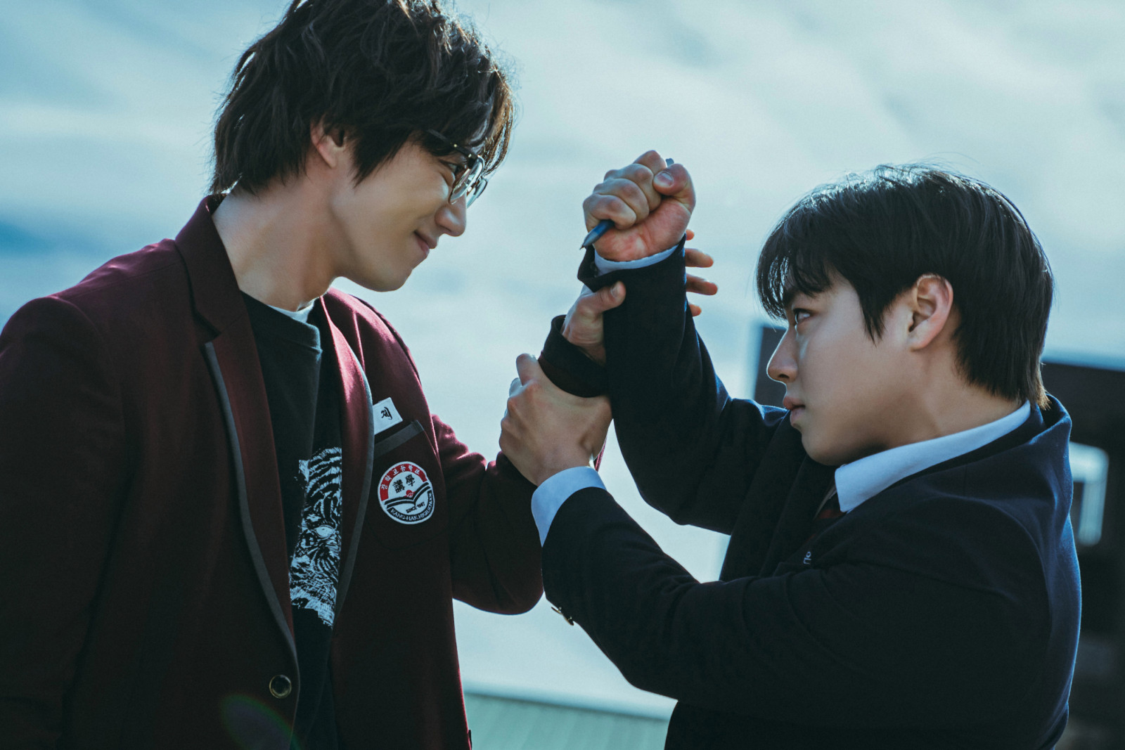 Minimalist school uniforms, restrained colour palettes and precise grooming heighten tension in a pared-back, mood-driven world (Photo: Darae Lee/Netflix © 2025)