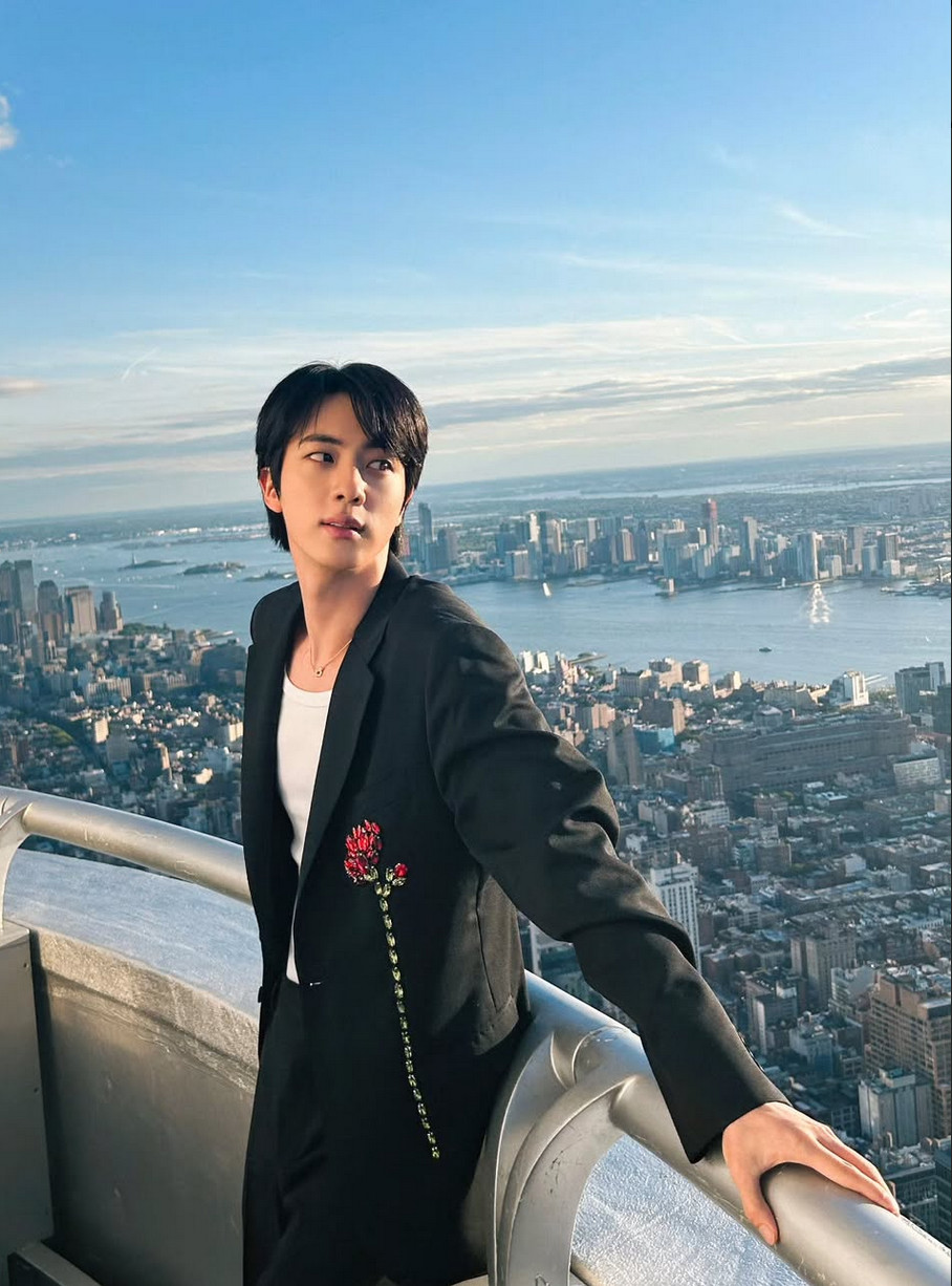 Jin, wearing a Simone Rocha jacket with embroidered flowers, evokes dark drama (Photo: @jin / Instagram)