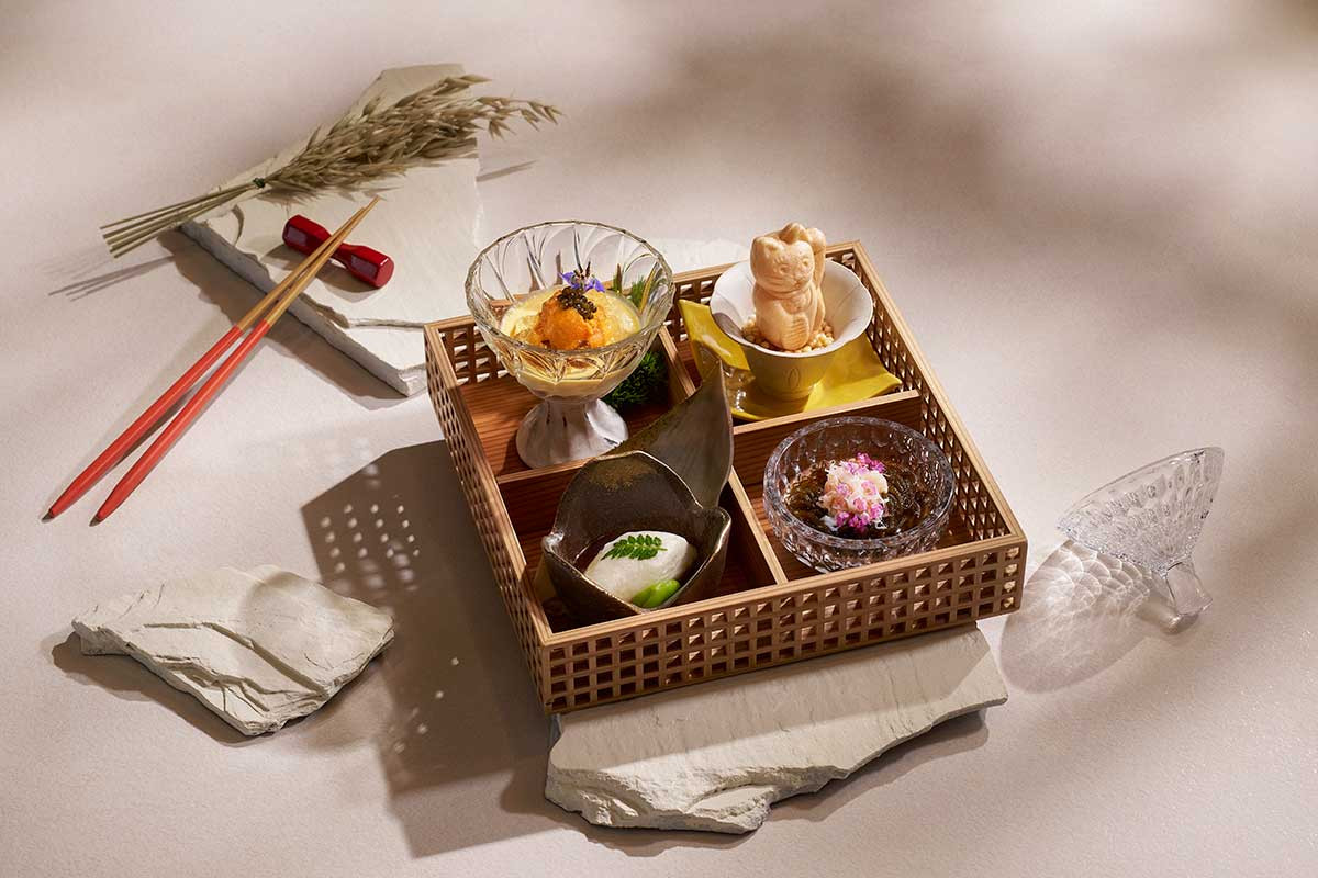 Four kinds of appetisers in a kaiseki box