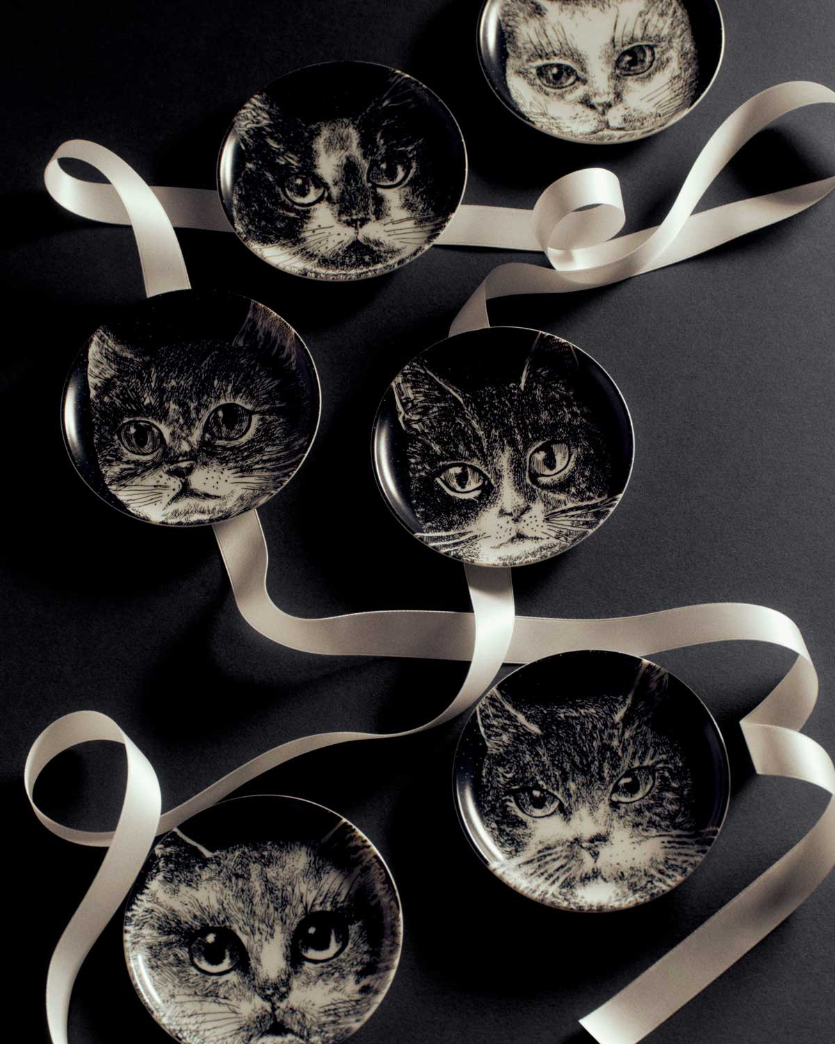 Set of six Fornasetti Gatti decorative holders