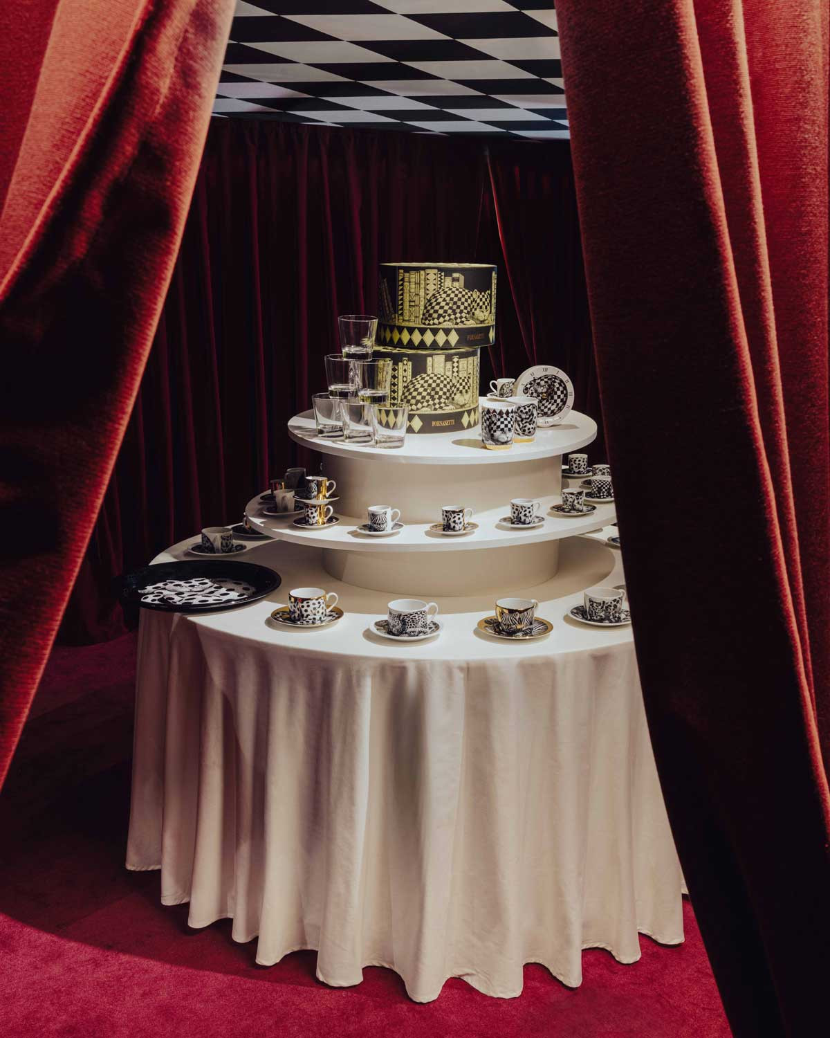 Tableware displayed at the Fornasetti L’Heure du Chat exhibition