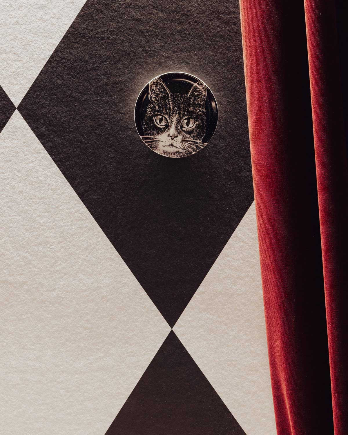 A Gatti decorative holder displayed at the Fornasetti L’Heure du Chat exhibition