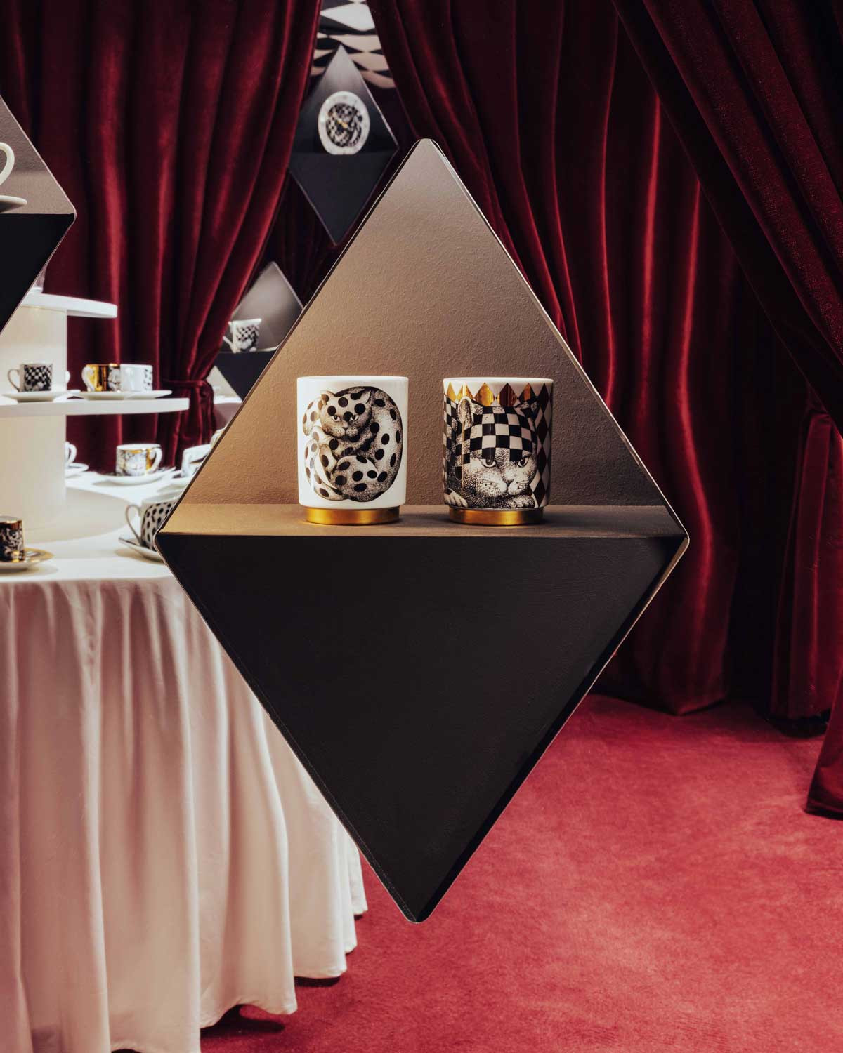 Scented candles displayed at the Fornasetti L’Heure du Chat exhibition