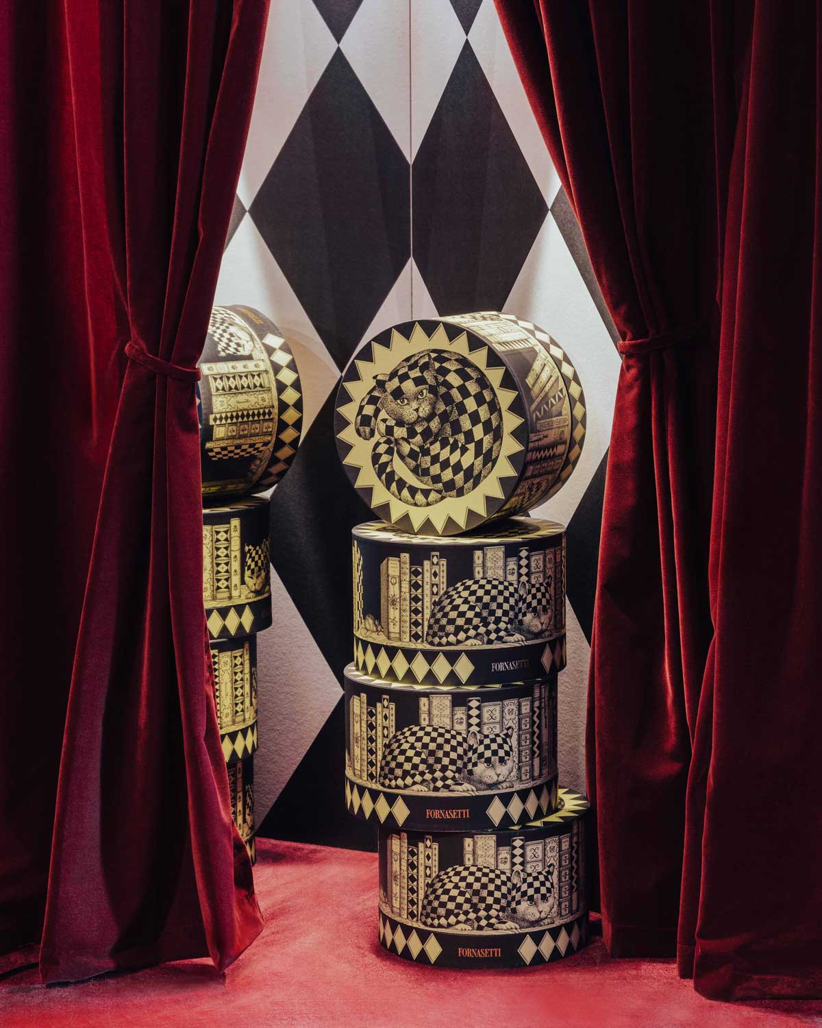 Panettone boxes displayed at the Fornasetti L’Heure du Chat exhibition