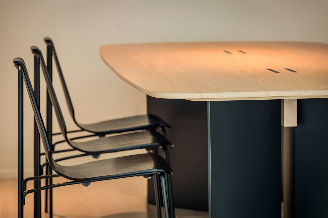 The bespoke dining table was designed by the architect and crafted by Harith Chin