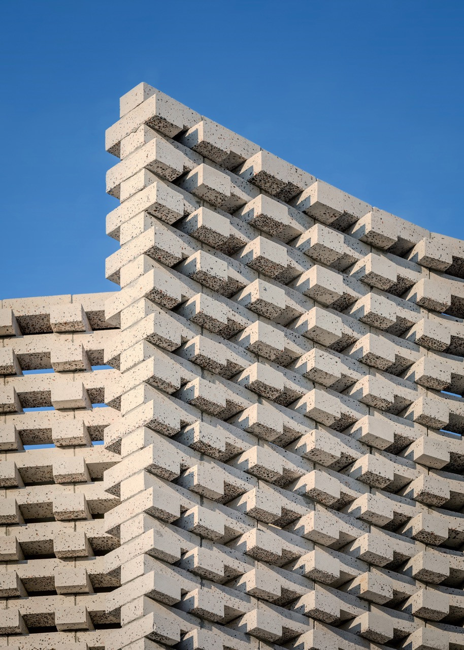 The terrazzo-like bricks provide tactile richness whilst contributing to the passive thermal strategy of the house