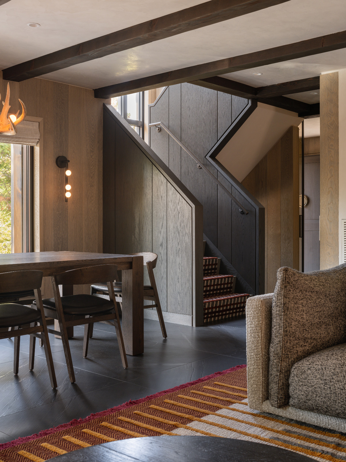 The living room of a renovated ski chalet in Quebec, Canada, designed by ACDO