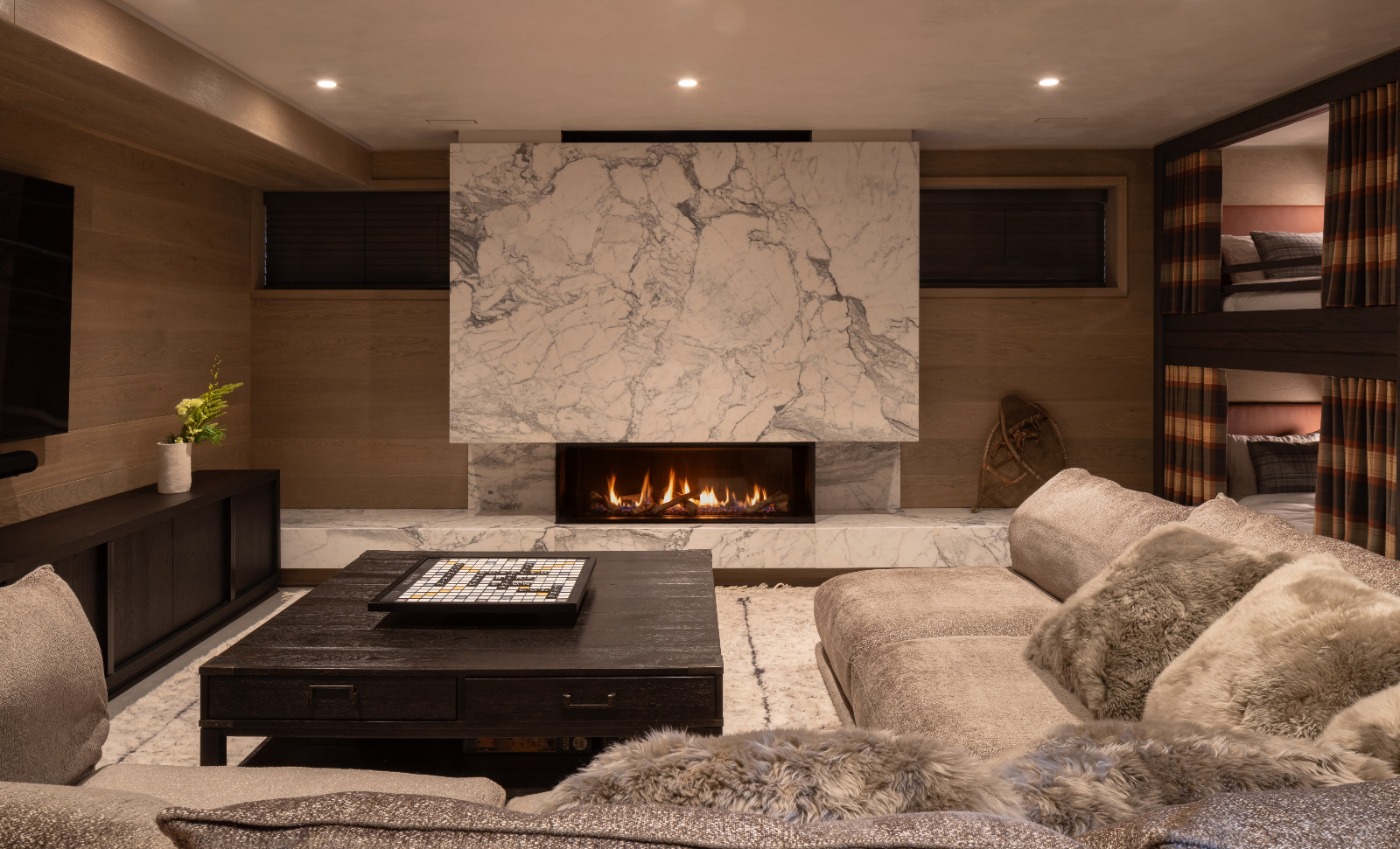 The lounge of a bedroom located in a renovated ski chalet in Quebec, Canada, designed by ACDO
