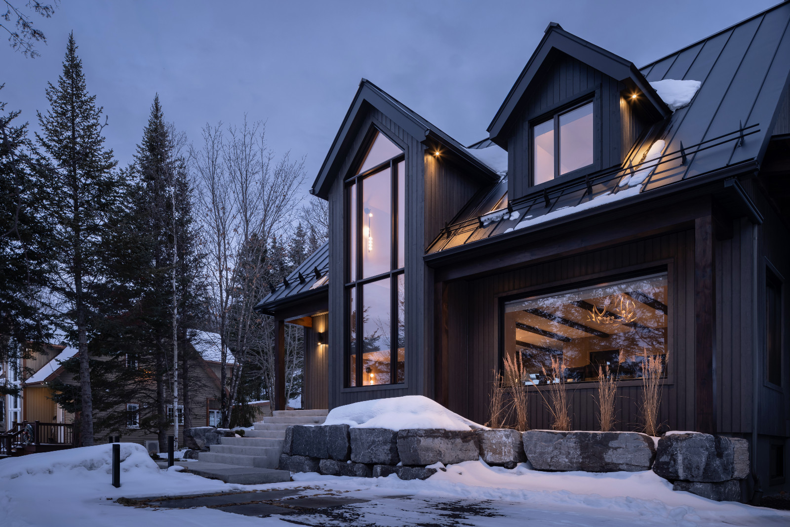 The exterior area of a renovated ski chalet in Quebec, Canada, designed by ACDO