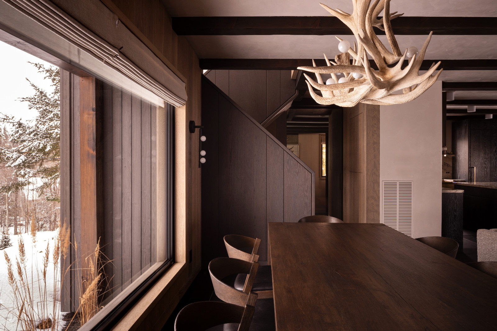 The dining area of a renovated ski chalet in Quebec, Canada, designed by ACDO